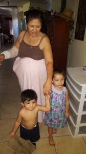 Her Grandchildren helping her get around the house..the children brings her happiness